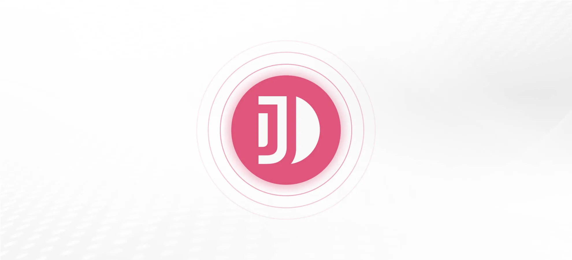 Pink circular logo featuring the white letters ‘JD’ in a modern font, surrounded by faint concentric rings on a white gradient background.